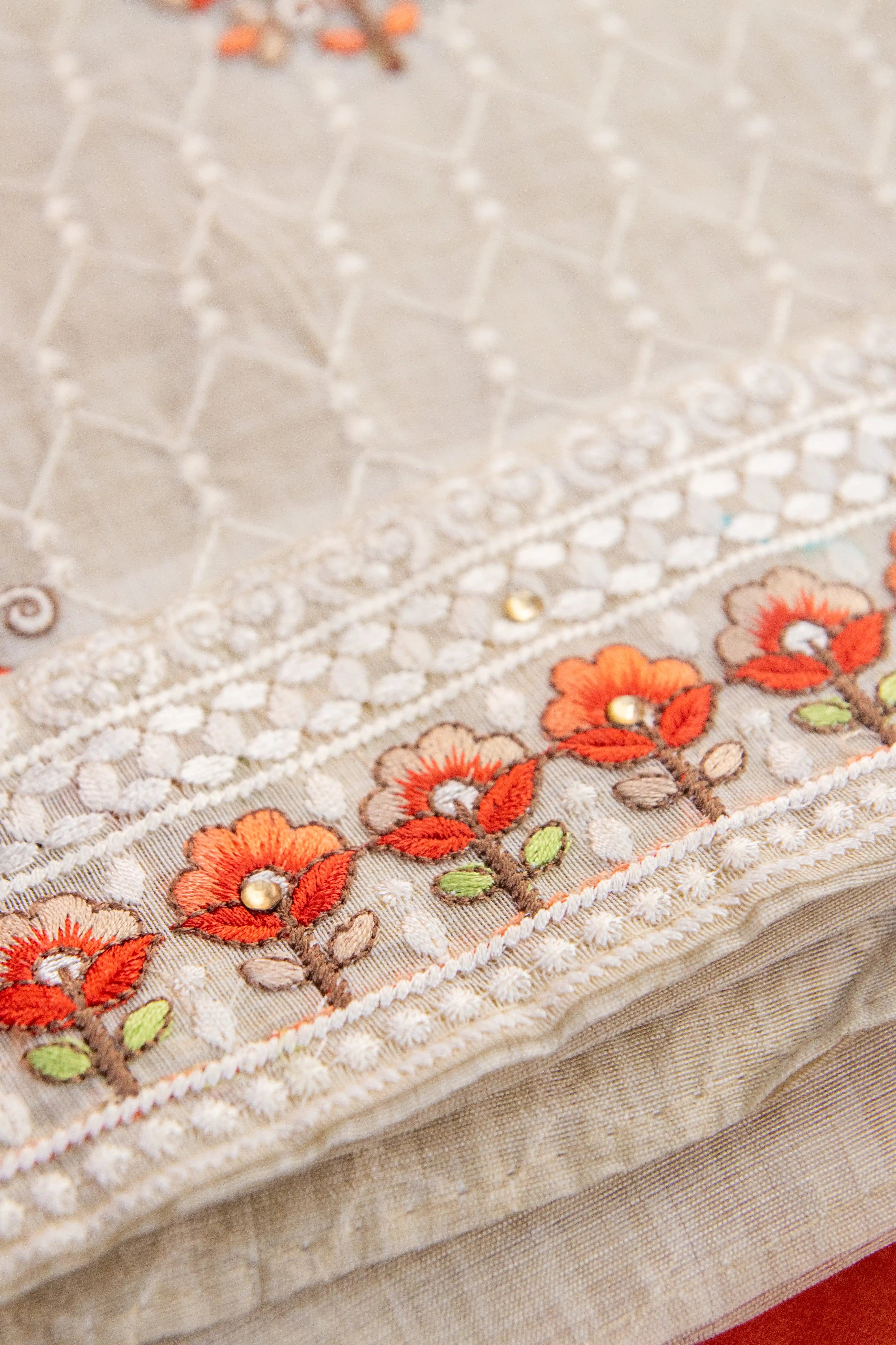 Cream & Orange Embroidered dress material